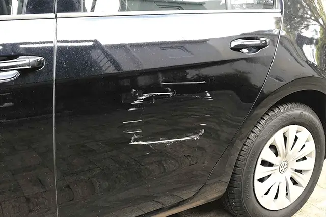 Car Scratches on a Black Car